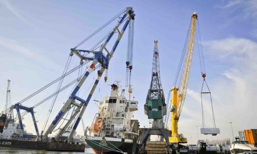 loading-with-floating-crane-and-heavy-lift-crane-at-rhb-stevedoring-rotterdam-1-1300×865 "stevedoring services," "port cargo handling," "ship loading/unloading," "dock labor," "terminal operations"